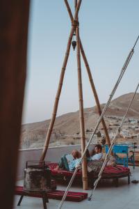 two children playing on a pirate shipousel at Nomads Hotel Petra in Wadi Musa