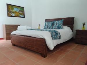 Postel nebo postele na pokoji v ubytování Casa Flórez Hotel Campestre