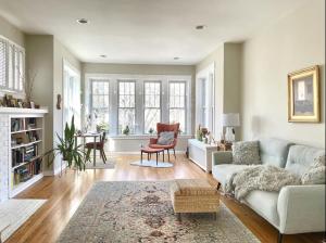 a living room with a couch and a table at Lovely Family Friendly Home- Free Parking in Evanston