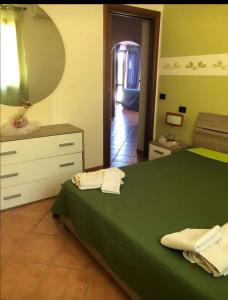 Postel nebo postele na pokoji v ubytování appartamento in villa splendente