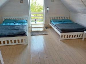 Ένα ή περισσότερα κρεβάτια σε δωμάτιο στο Willa Prestige Sianożęty