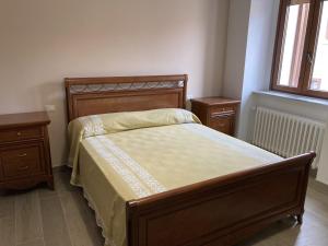 a bedroom with a bed and two night stands at Dimora storica don Michele in Castelpagano