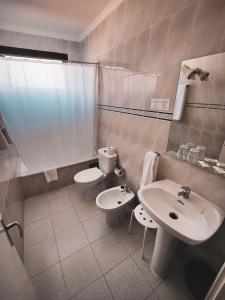 Koupelna v ubytování Hotel Olympia
