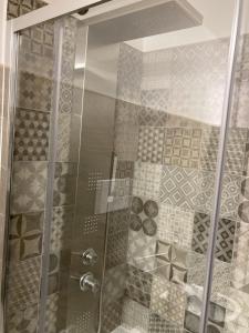 a shower with a glass door in a bathroom at Dimora storica don Michele in Castelpagano