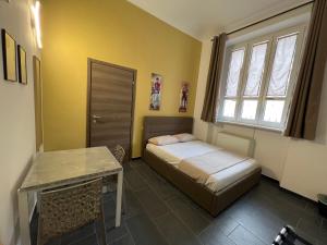 Postel nebo postele na pokoji v ubytování Hostel Turin Metro Young