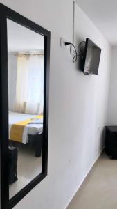 TV a/nebo společenská místnost v ubytování Hotel sol de uraba