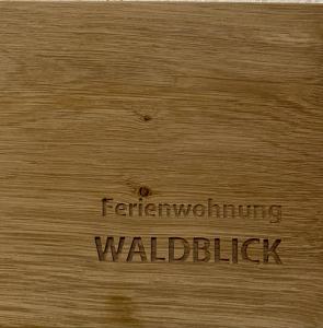 a piece of wood with the words walicked at Ferienhof Weber Nieratz in Wangen im Allgäu