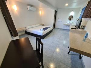 Postel nebo postele na pokoji v ubytování Hotel Vista Laguna Bacalar