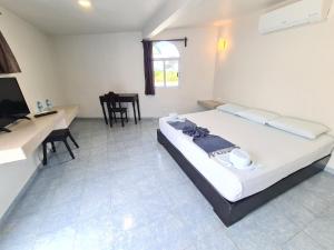 Postel nebo postele na pokoji v ubytování Hotel Vista Laguna Bacalar