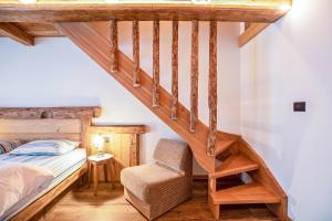 Posteľ alebo postele v izbe v ubytovaní Chalet Osmar Appartamento 2