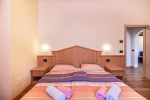 Posteľ alebo postele v izbe v ubytovaní Chalet Osmar Appartamento 2