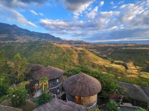 an aerial view of a resort with mountains in the background at Sora Lodge Lalibela in Lalībela