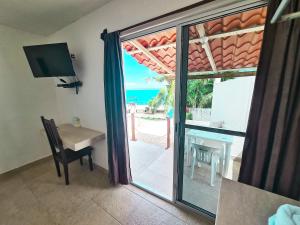 TV a/nebo společenská místnost v ubytování Hotel Vista Laguna Bacalar