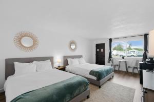 Postel nebo postele na pokoji v ubytování Silver Sands Motel