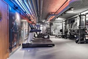 a gym with tread machines and a treadmill at Best Western and Hotel Linkoping in Linköping