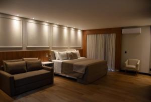 Postel nebo postele na pokoji v ubytování Hotel Titanic Penedo