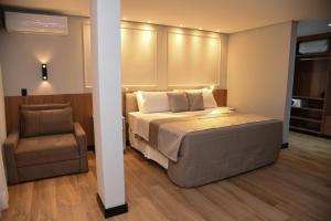 Postel nebo postele na pokoji v ubytování Hotel Titanic Penedo