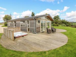 a large deck with a tiny house on it at 12 Horizon View in Liskeard