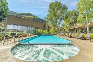 a swimming pool in front of a building at Pitkin Creek #7H in Vail
