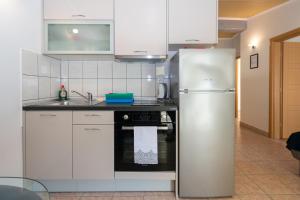 Kuchyň nebo kuchyňský kout v ubytování Apartment Mandre 4093b