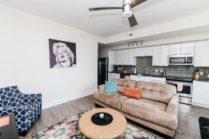 a living room with a couch and a table at 1BR Uptown Charlotte Furnished Apartments apts in Charlotte