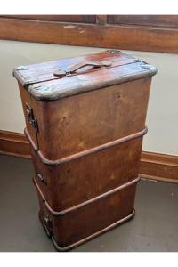 two old suitcases stacked on top of each other at Grand Old White Artist's Loft in Charleston