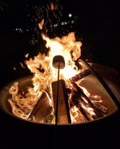 a pot of fire with a stick in it at Cape Cod Veranda in South Yarmouth