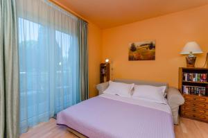 Posteľ alebo postele v izbe v ubytovaní Apartment Benzon