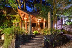 a house with stairs leading up to it at night at Villa Gabrielle in Byron Bay