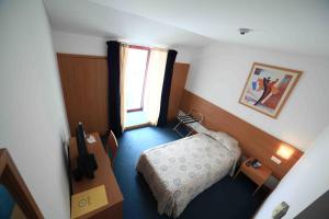 Postel nebo postele na pokoji v ubytování Hotel Matriz