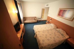 Postel nebo postele na pokoji v ubytování Hotel Matriz