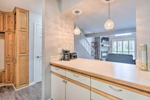 a kitchen with white cabinets and a counter top at Ellicottville Townhome about Half Mi to Slopes! in Ellicottville