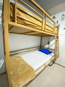 a bedroom with bunk beds in a dorm room at Neo Robiu & Ijen Tour in Banyuwangi