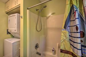 a shower in a bathroom with a toilet and a sink at Quaint Hinton Hideaway - Hunt and Fish Nearby! in Hinton +17 photos