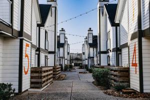 a row of white houses on a street at Park Suite King Bedparking 24 Hr Gym in Houston