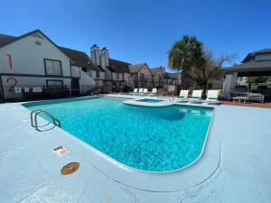 a swimming pool with blue water in a house at Park Suite King Bedparking 24 Hr Gym in Houston