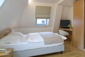 Ένα ή περισσότερα κρεβάτια σε δωμάτιο στο Hotel Simoncini
