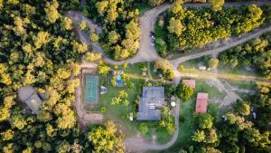 an overhead view of a yard with roads and trees at Ferns Hideaway Resort in Byfield