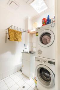 a laundry room with a washing machine in it at Midnights in Morocco in Brisbane
