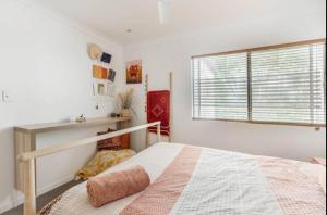 a bedroom with a bed and a window at Midnights in Morocco in Brisbane