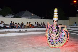 a woman in a costume with a pyramid on her head at Golden Empire luxury Resort in Sām