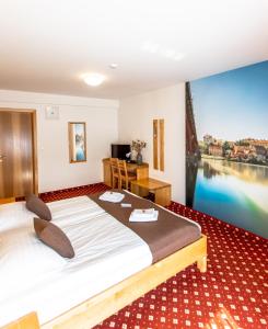 Postelja oz. postelje v sobi nastanitve Hotel Bau Maribor