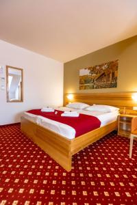 Postelja oz. postelje v sobi nastanitve Hotel Bau Maribor