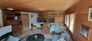an overhead view of a kitchen in a log cabin at 2 bedroom chalet with a mountain view in Saint-Jean