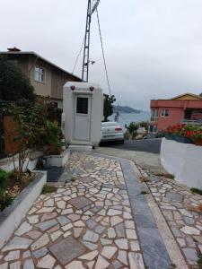 a house with a generator on the side of a driveway at Tarabya Family Suit in Istanbul