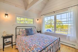 a bedroom with a bed and a large window at Sunny Stockton Springs Home Less Than 1 Mi to Beach! in Stockton Springs