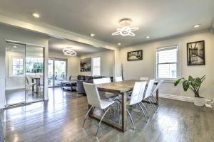 a dining room and living room with a table and chairs at New Haven Gem with Private Pool, Walk to Beach! in New Haven