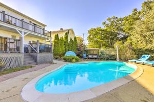 a swimming pool in the backyard of a house at New Haven Gem with Private Pool, Walk to Beach! in New Haven