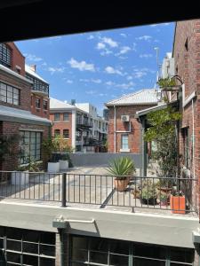 a view from the balcony of a building at Loft Apartment Cape Town The Waterkant in Cape Town