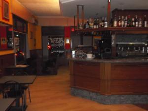 a bar in a restaurant with a counter top at Locanda La Cascina in San Giuliano Milanese